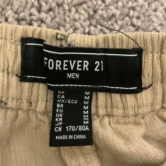 Forever 21 beige corduroy pants with mushroom, yin yang, and dice prints on it. - Picture 3 of 3